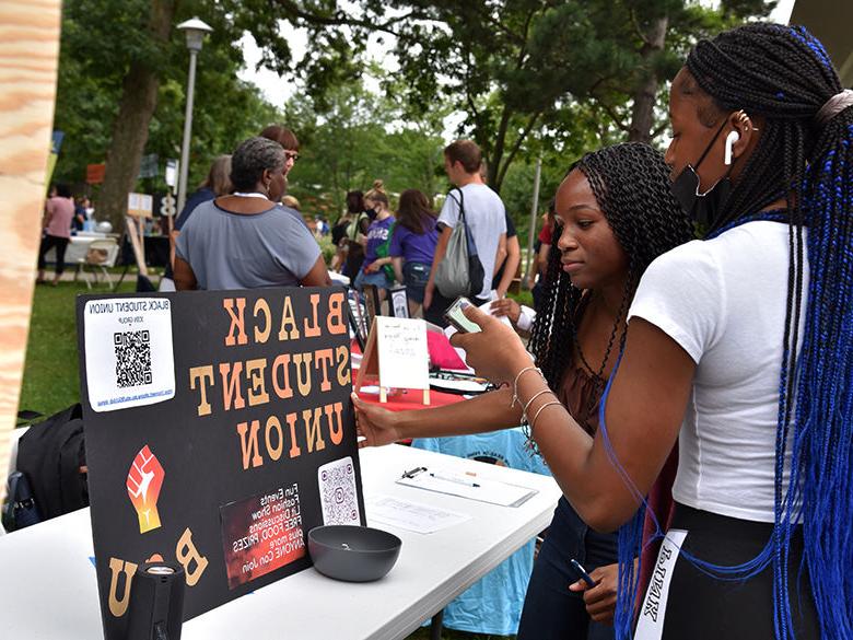 Students getting information about the Black Student Union at the annual involvement fair